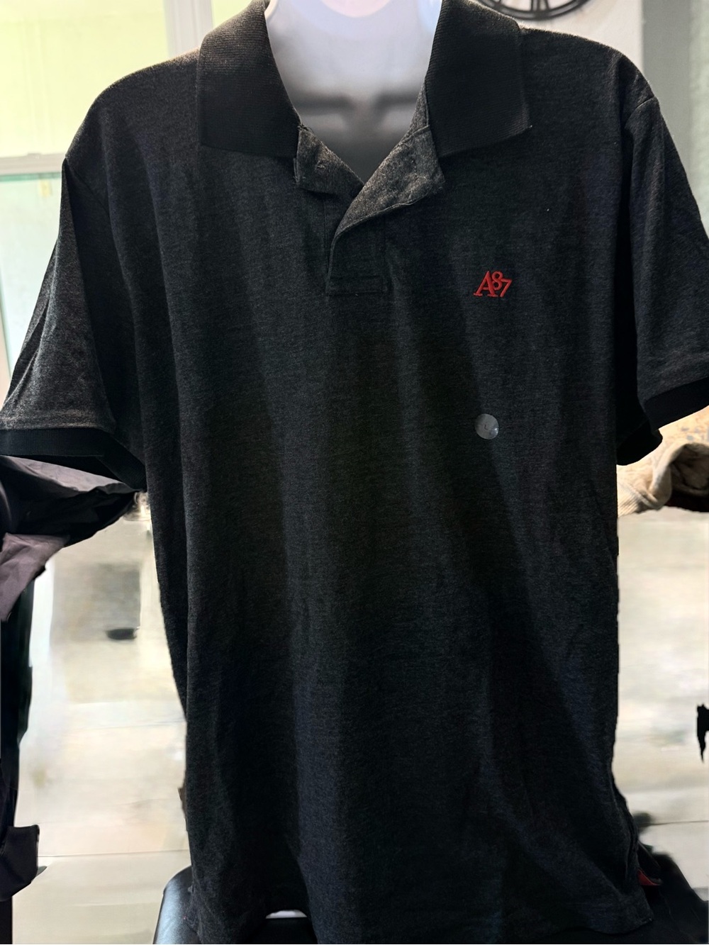 Men’s Black Polo Shirt with Red Logo